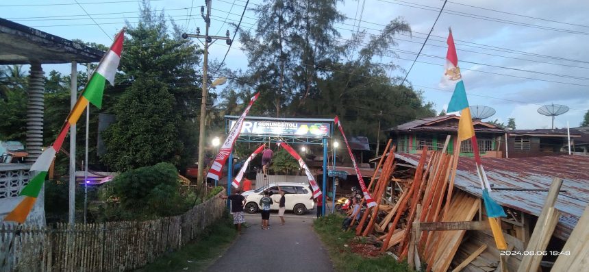 Warga sedang memasang Umbul-umbul di Balai Desa Iraonogeba. Sumber: rri.co.id